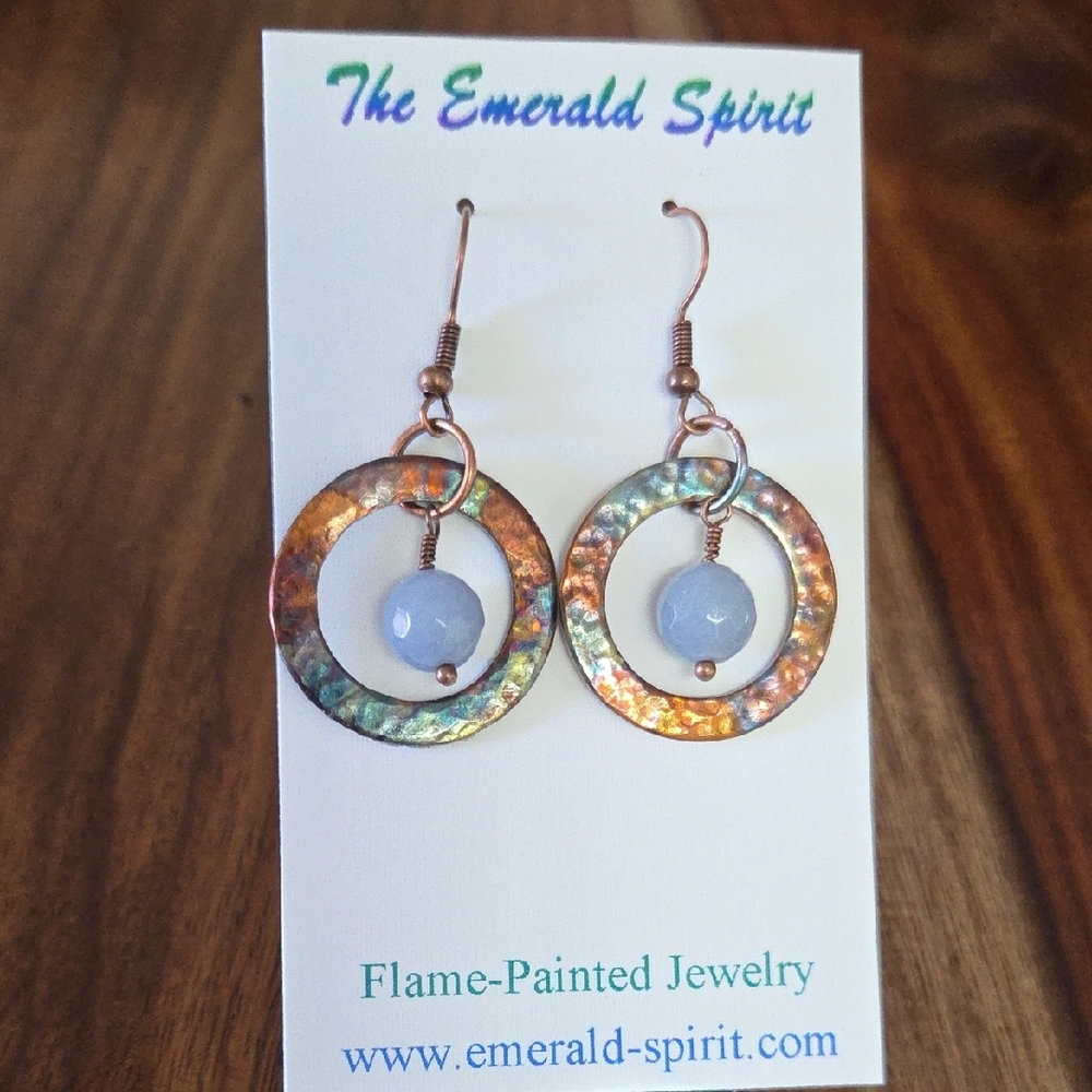 Flame-Painted Copper Circle Earrings With Blue Bead Accent